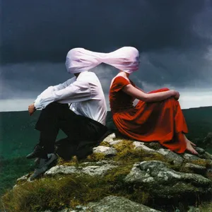 Casually dressed & deep in conversation